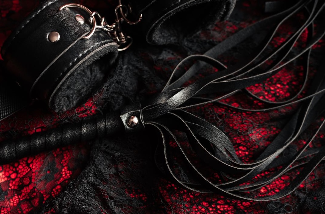 sex accessories on a bed